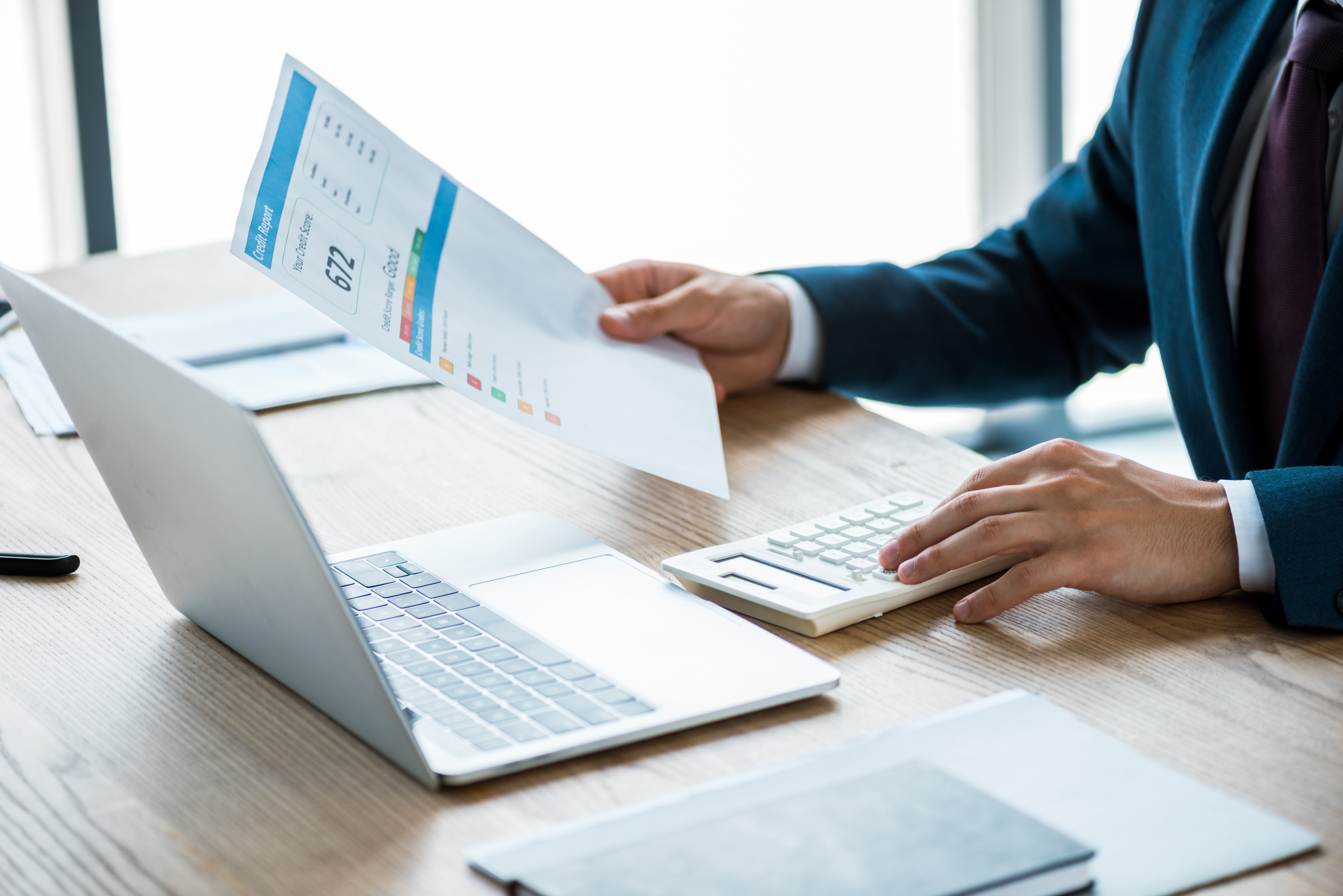 cropped-view-of-businessman-holding-paper-with-cre-2022-12-16-19-37-07-utc