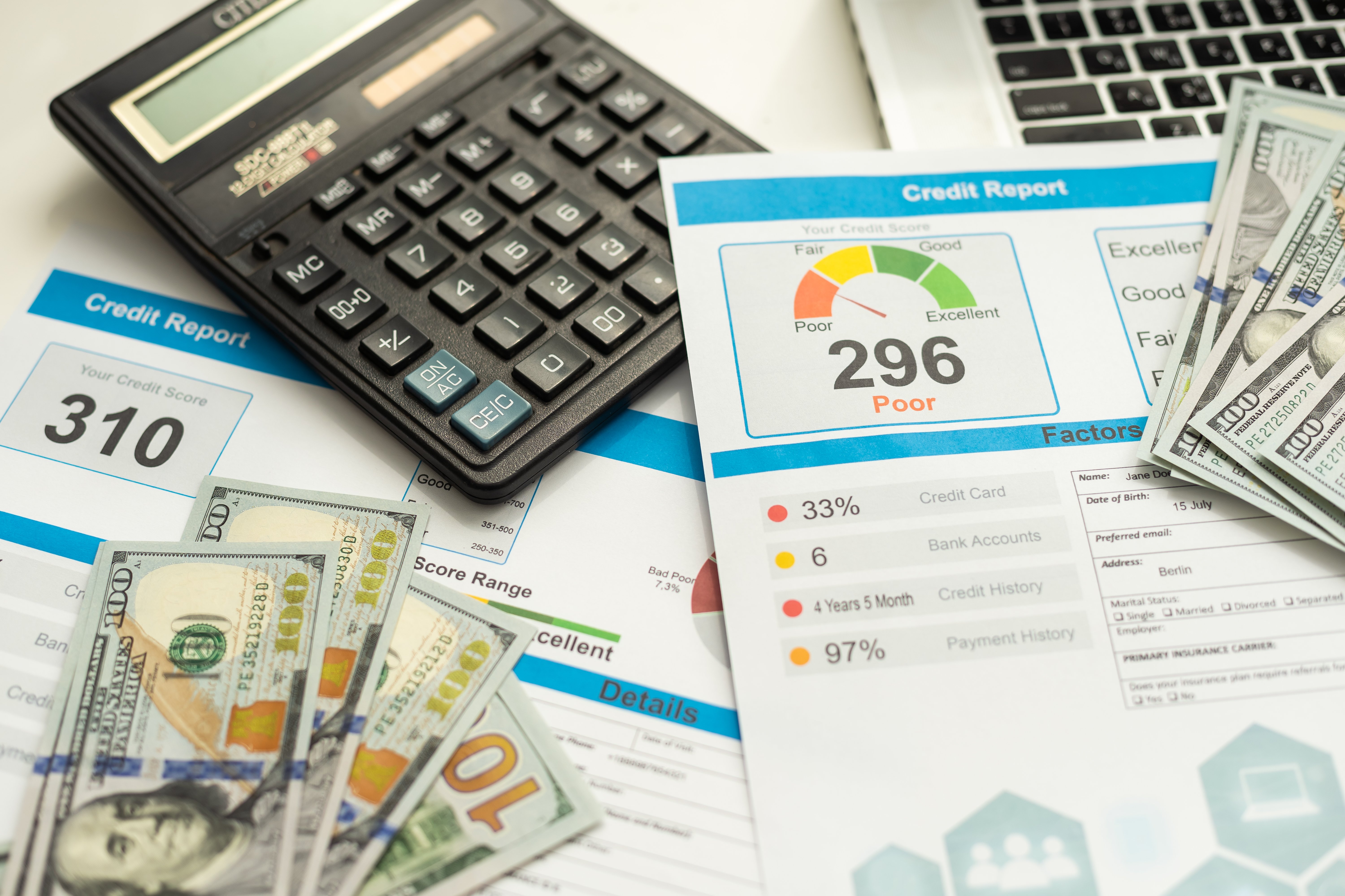 poor-credit-score-report-with-pen-and-calculator-2023-07-03-19-28-37-utc (1)